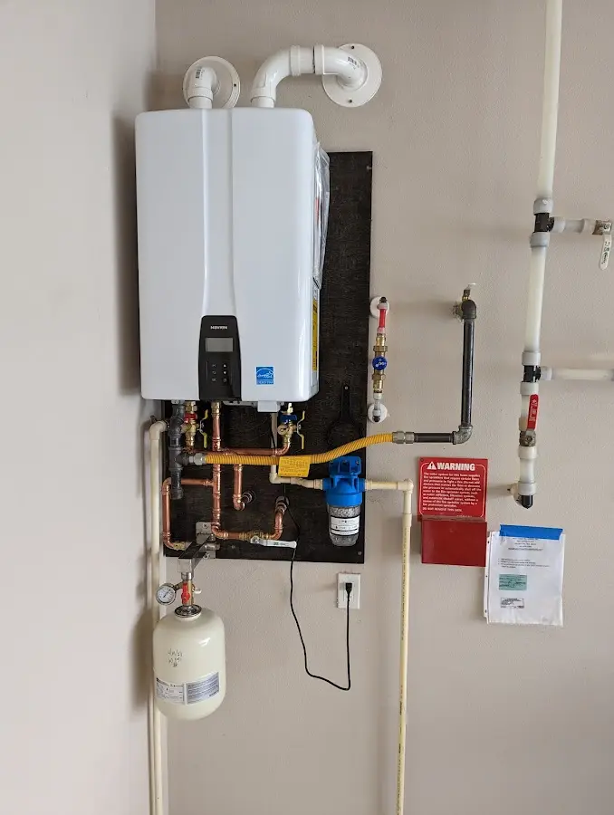 Professional plumber installing copper piping in a Fair Oaks home